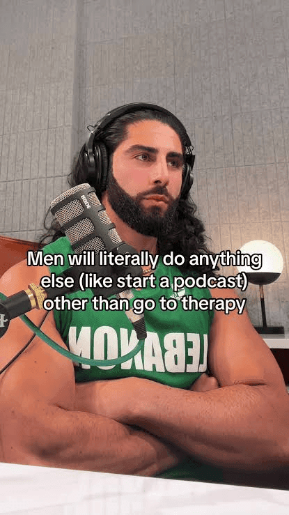 a-man-with-a-beard-and-long-hair-wears-headphones.png